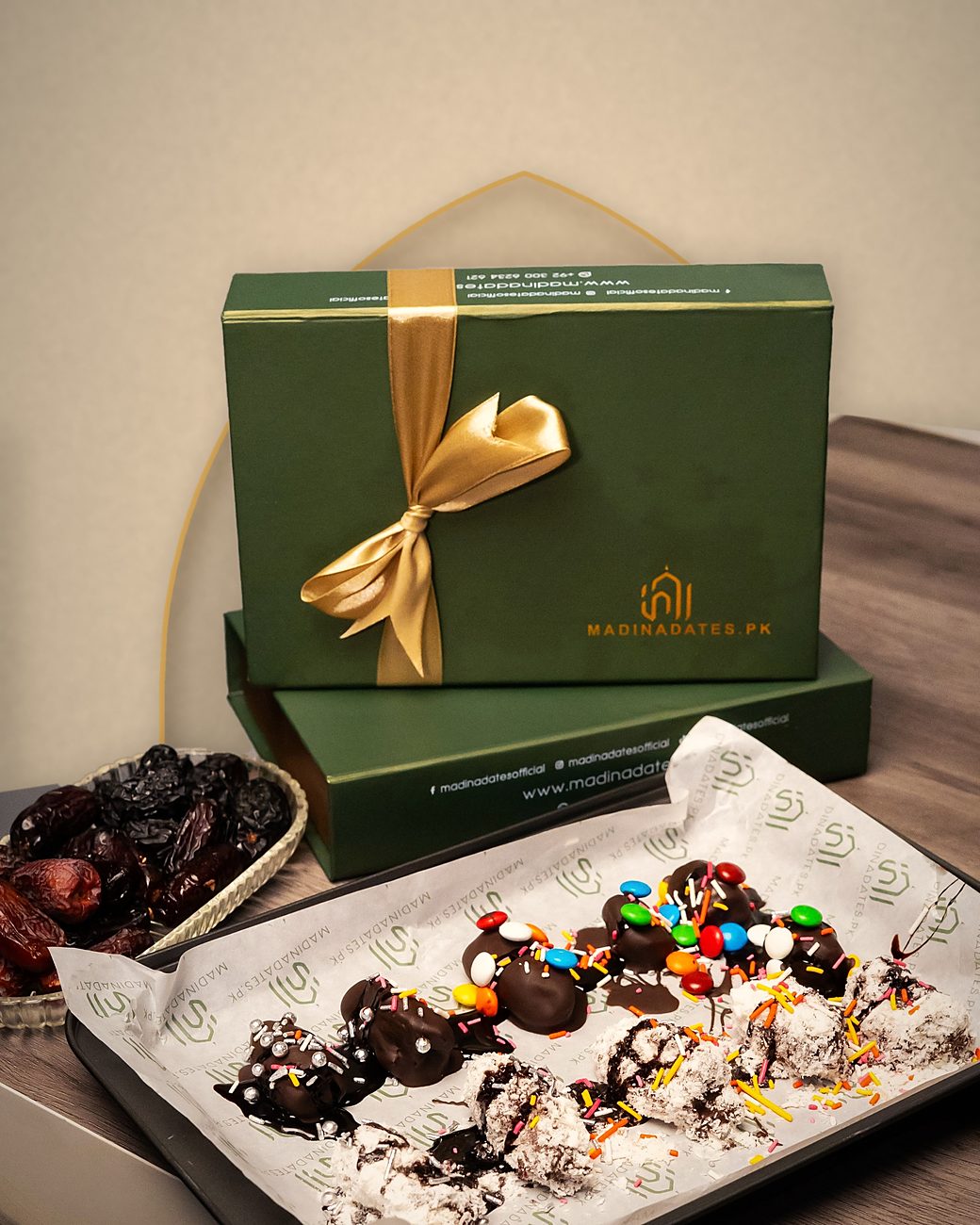 MadinaDates.pk gift boxes with a tray of chocolate and coconut topped dates